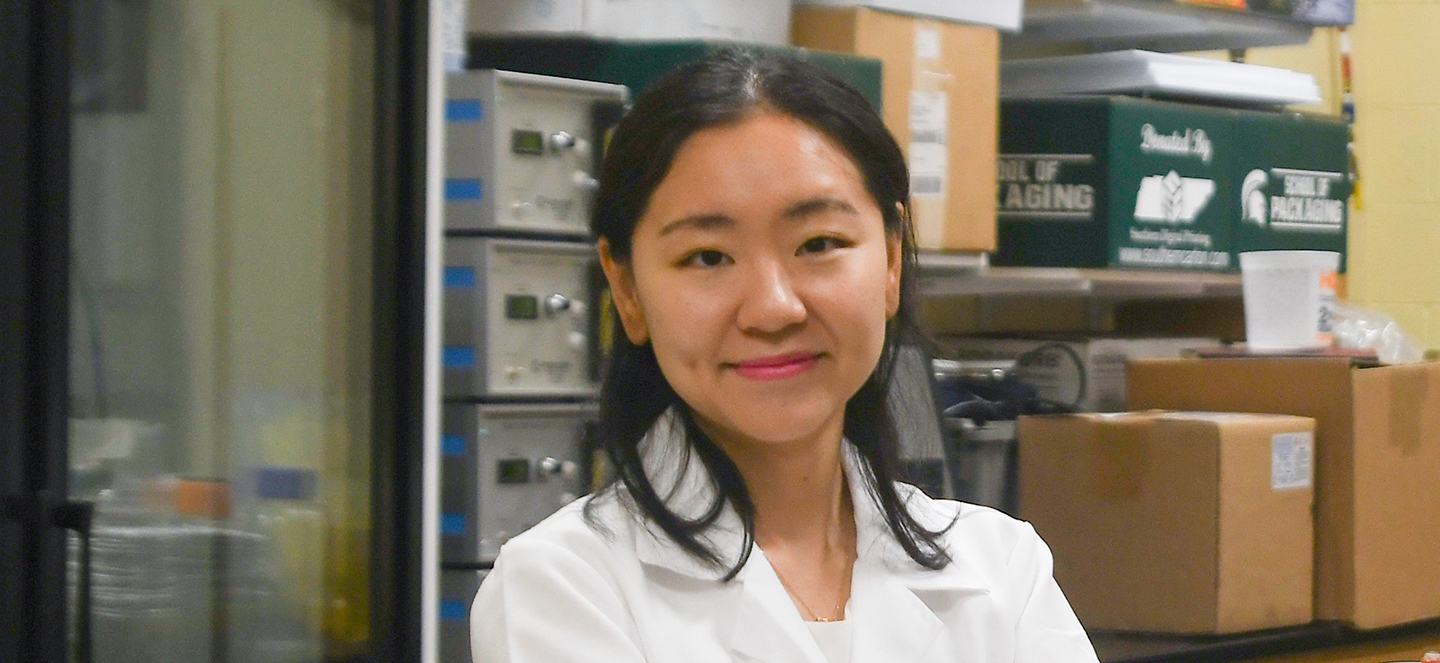 Woman in white lab coat