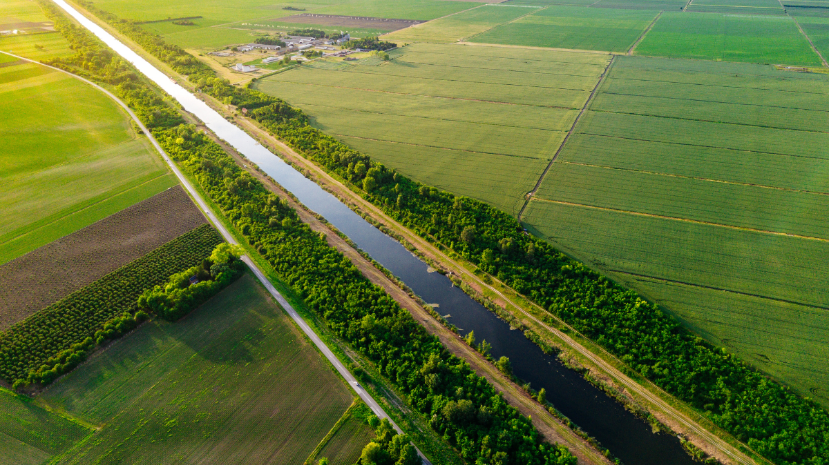Open field with river running through it.