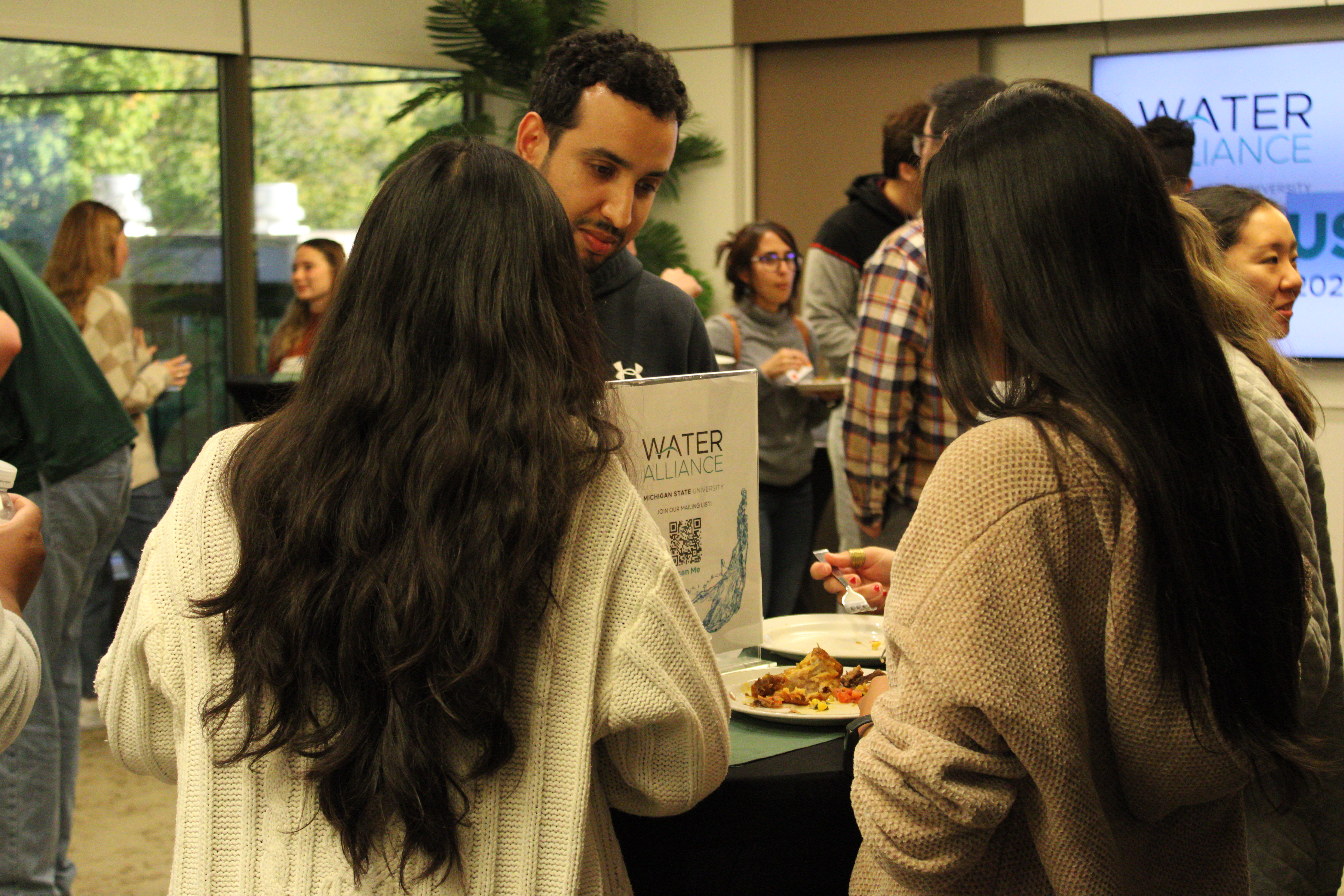 People eating at ECP event.