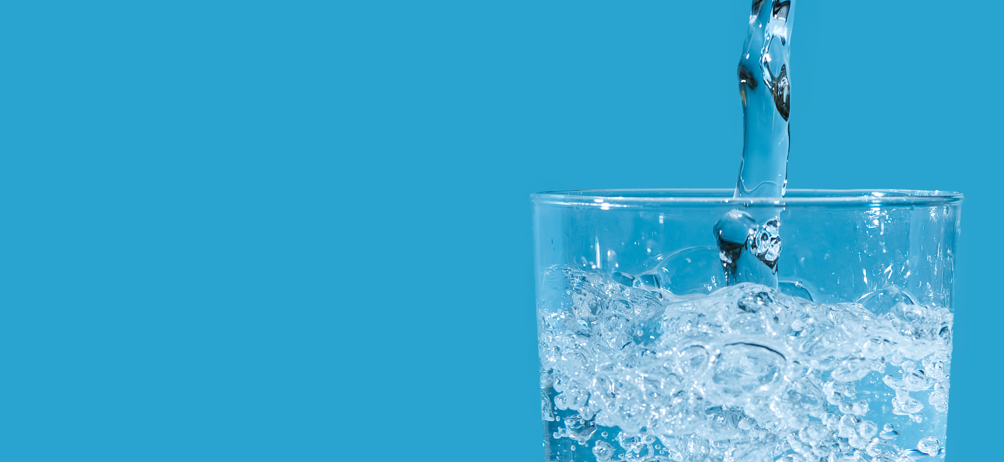 Water being poured into a glass.