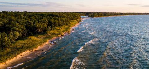 aerial view of beach coastline at sunset