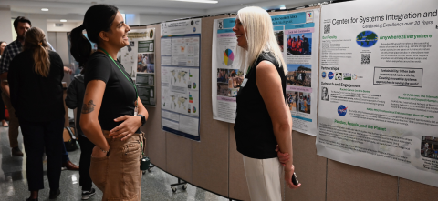 Attendees connect during the 75th Anniversary Symposium Poster & Networking Session.