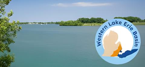 A calm lake scene with trees and a Western Lake Erie Basin logo in the foreground.