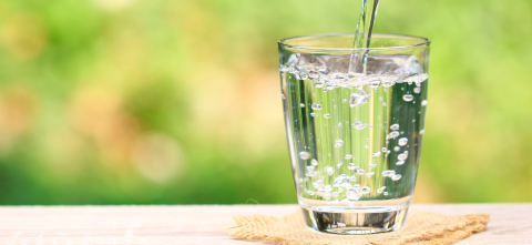 Water being poured into a glass.