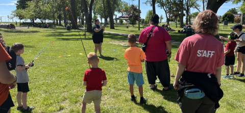 Angela Scapini leads a summer fishing class with children in the Adaptive Playground Program.